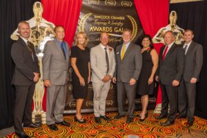 Coast Electric representatives accept an award at the Hancock Chamber Gala for being the county's Industry of the Year. 